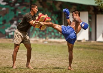 BAN CHAN KREM, Thailand -- During a cultural exchange, a Royal Thai Marine demonstrates his kicking ability which he utilizes for Thai boxing at the Ban Chan Krem training area here Feb. 15. Royal Thai Marines, Republic of Korea Marines and U.S. Marines with Combat Assault Battalion, 3rd Marine Division, III Marine Expeditionary Force, conducted trilateral training during Cobra Gold '12. Cobra Gold is a recurring multinational and multiservice exercise hosted by the Royal Kingdom of Thailand designed to advance regional security by exercising a multinational force from nations sharing common goals and security commitments in the Asia-Pacific region. (U.S. Marine Corps photo by Sgt. Brandon L. Saunders/released)