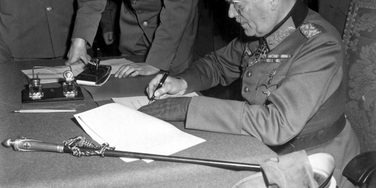 Field Marshall Wilhelm Keitel, signing the ratified surrender terms for the German Army at Russian Headquarters in Berlin, Germany, May 7, 1945.  Lt. Moore. (Army)
NARA FILE #:  111-SC-206292
WAR & CONFLICT BOOK #:  1353